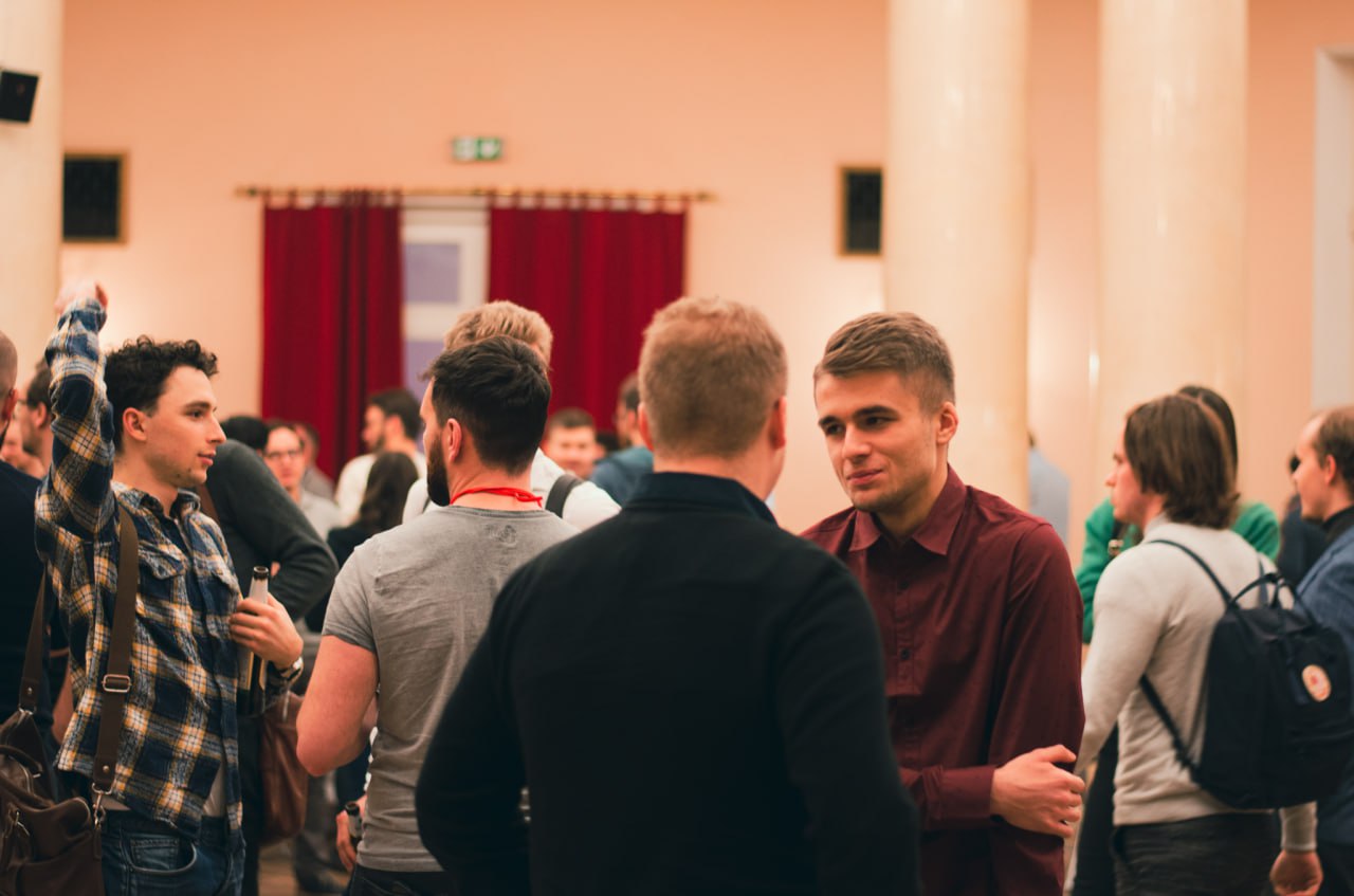 Two speakers on stage at MadeInBlockchain event